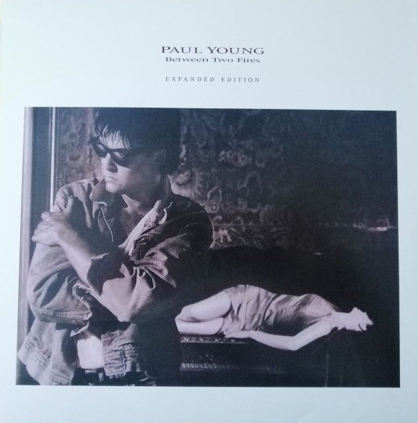 YOUNG, PAUL - BETWEEN TWO FIRES : 7 BONUS (FLAMING) - LP