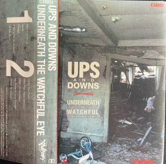 UPS AND DOWNS - UNDERNEATH THE WATCHFUL EYE (CASSETTE) - CS